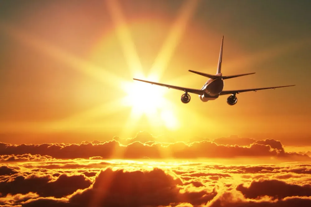 Transatlantic Flights Airplane Nondescript Flying Off Toward Sunset